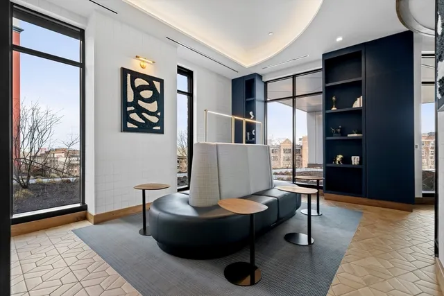 a living room with furniture and a rug