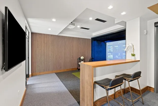 a view of an entryway with table and chairs