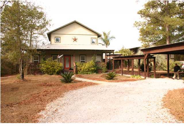 461 Bay Grove Road Freeport, FL 32439 - Photo 1 of 18 a front view of a house with a yard