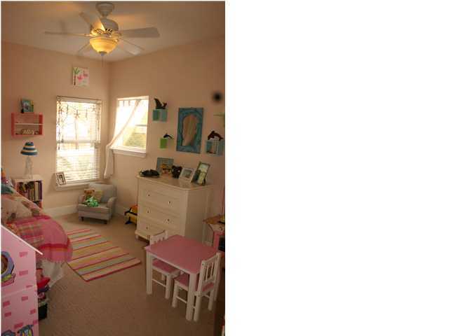 461 Bay Grove Road Freeport, FL 32439 - Photo 11 of 18 a living room with furniture and a chandelier