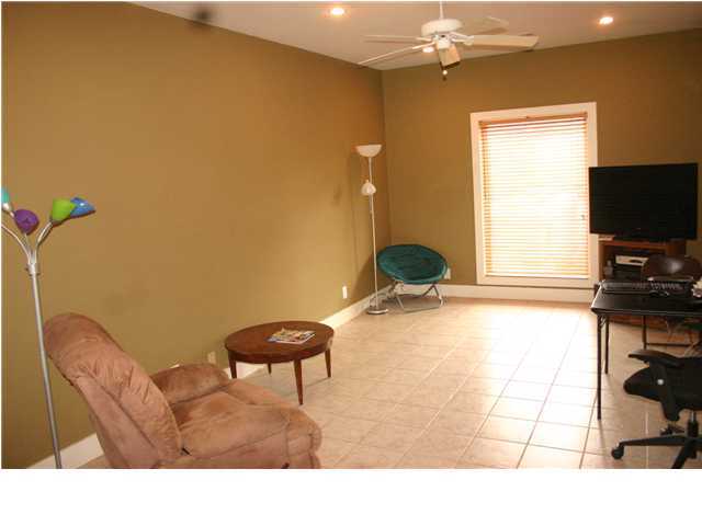 461 Bay Grove Road Freeport, FL 32439 - Photo 14 of 18 a living room with a couch and a flat screen tv