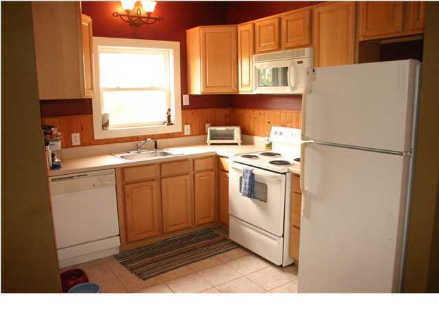 461 Bay Grove Road Freeport, FL 32439 - Photo 16 of 18 a white refrigerator freezer sitting inside of a kitchen