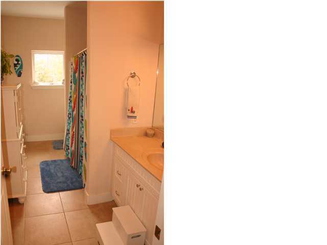 461 Bay Grove Road Freeport, FL 32439 - Photo 10 of 18 a bathroom with a bathtub and a sink