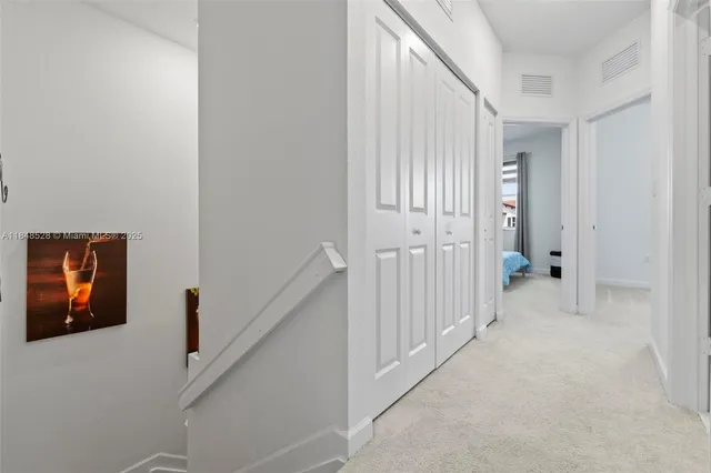 a view of a hallway with closet