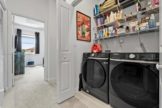 a utility room with dryer and washer