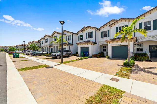 a view of multiple houses with a street