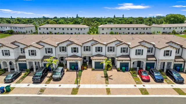 a view of multiple houses with a street