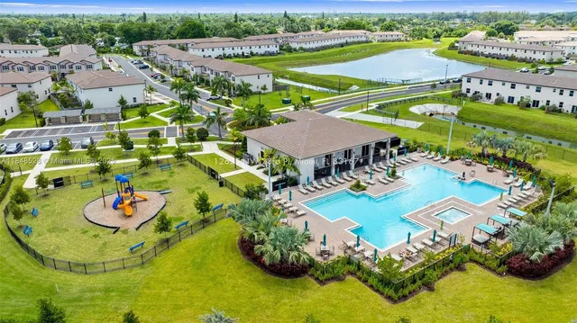 an aerial view of a patio and swimming pool