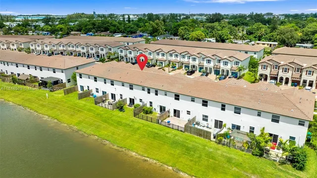an aerial view of a house with a ocean view