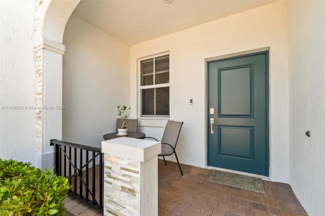 a view of a hallway with seating area