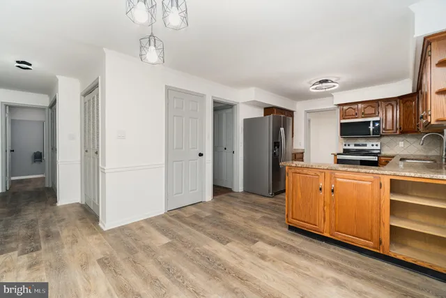 a large kitchen with cabinets
