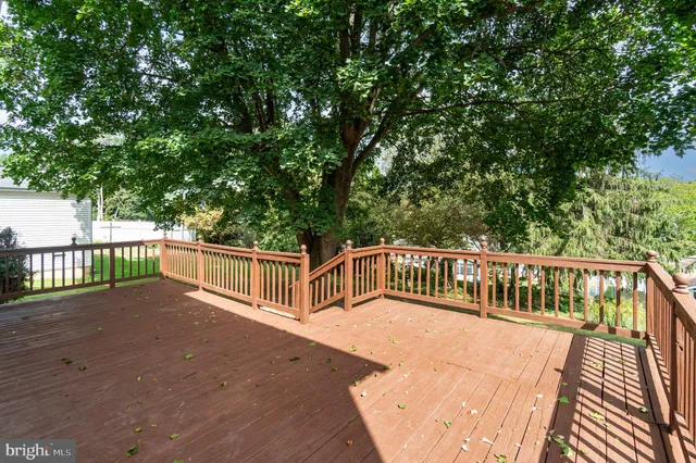 a view of a balcony with wooden floor