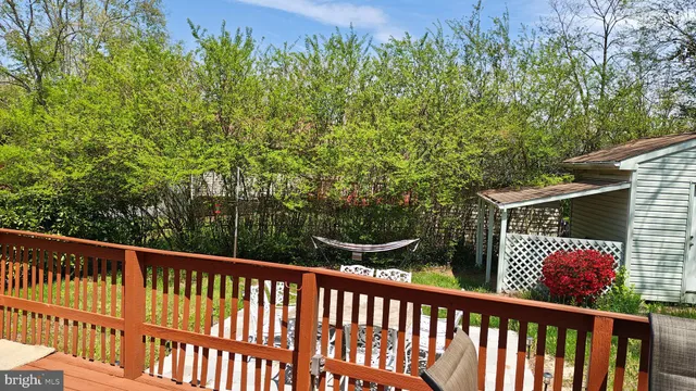 a view of a balcony with wooden fence