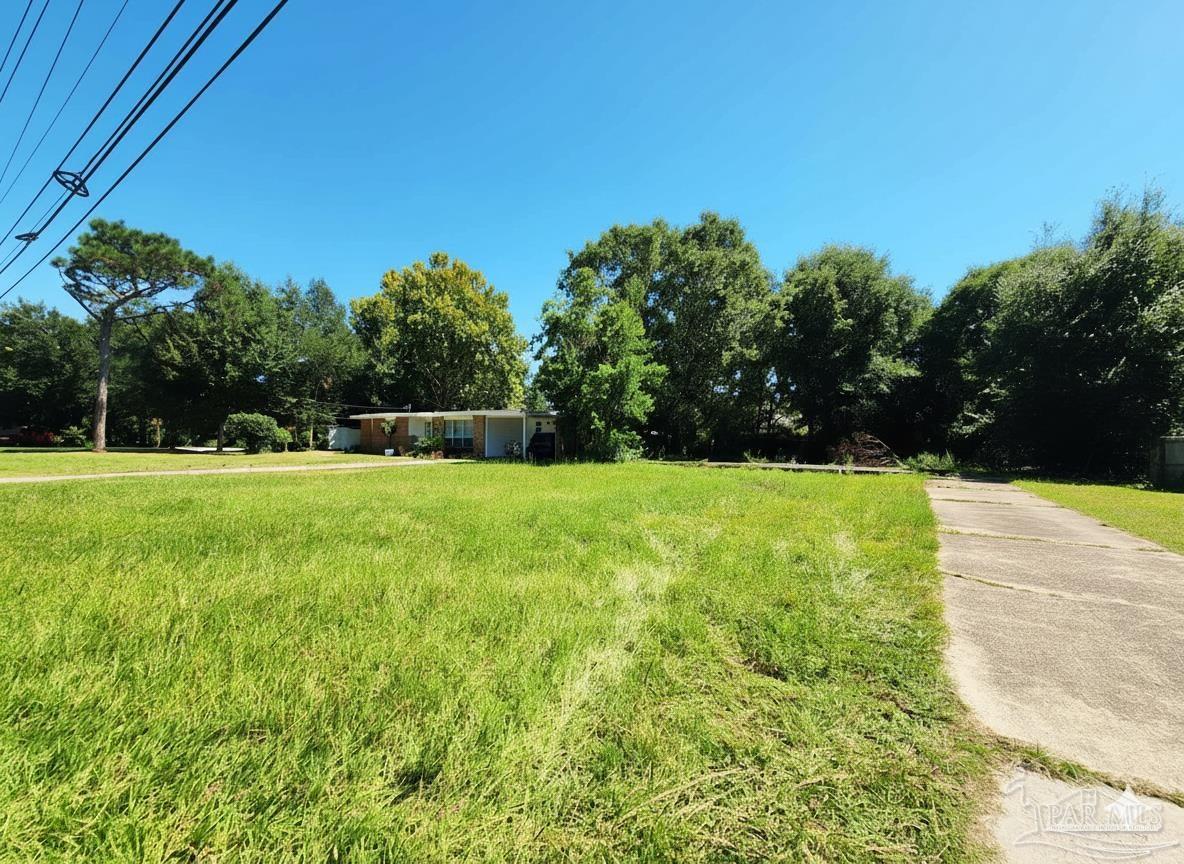 3545 Creighton Road Pensacola, FL 32504 - Photo 4 of 6 a view of green field with trees in the background