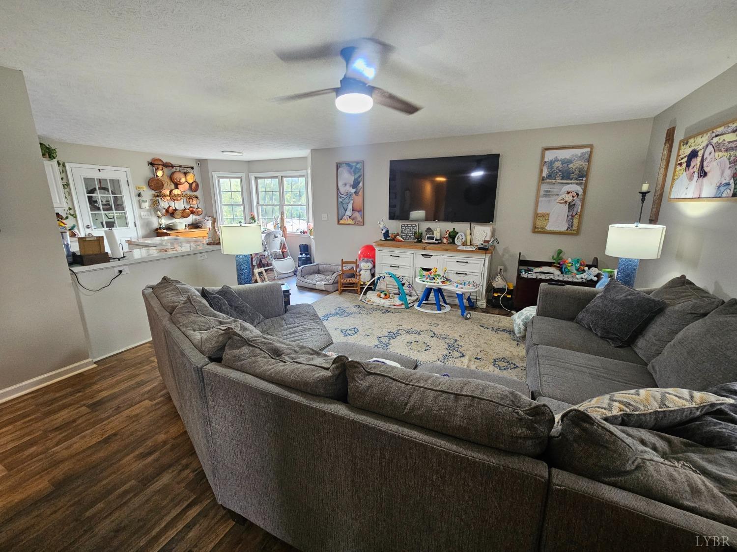 1390 Jacobs Road Hurt, VA 24563 - Photo 11 of 30 a living room with furniture and a flat screen tv