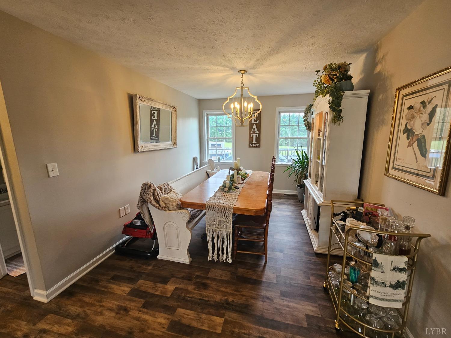 1390 Jacobs Road Hurt, VA 24563 - Photo 12 of 30 a living room with couches painting on the wall and a window