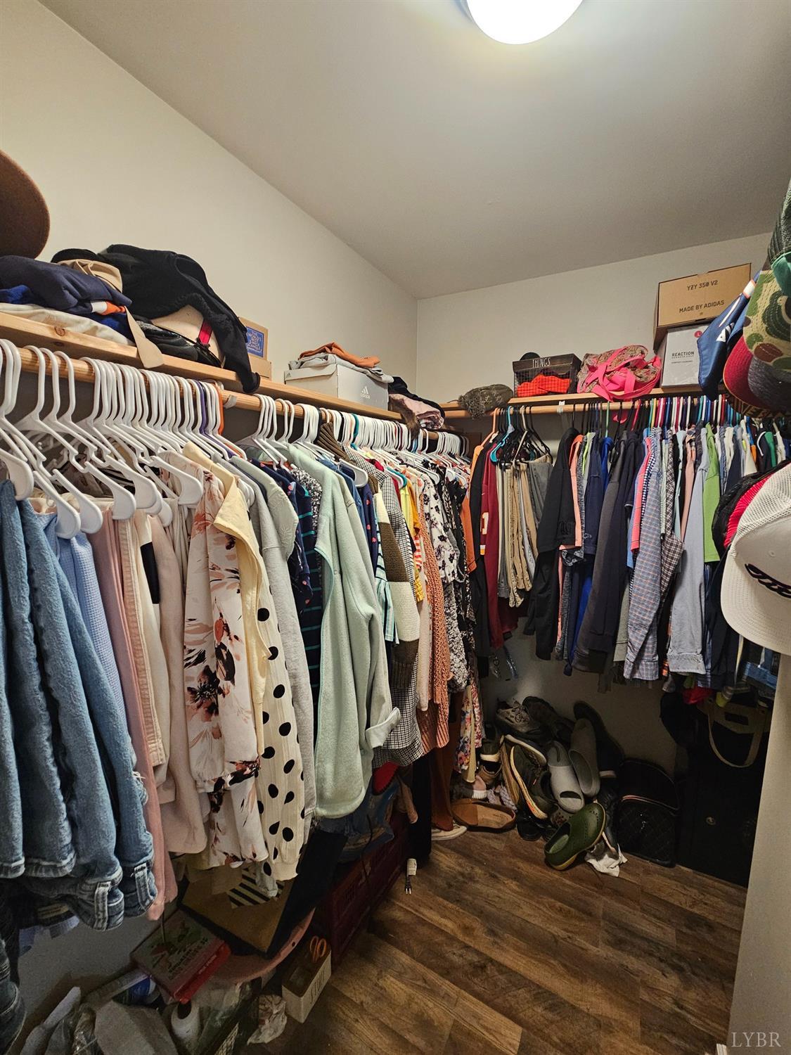1390 Jacobs Road Hurt, VA 24563 - Photo 19 of 30 a view of walk in closet with clothes and shoes