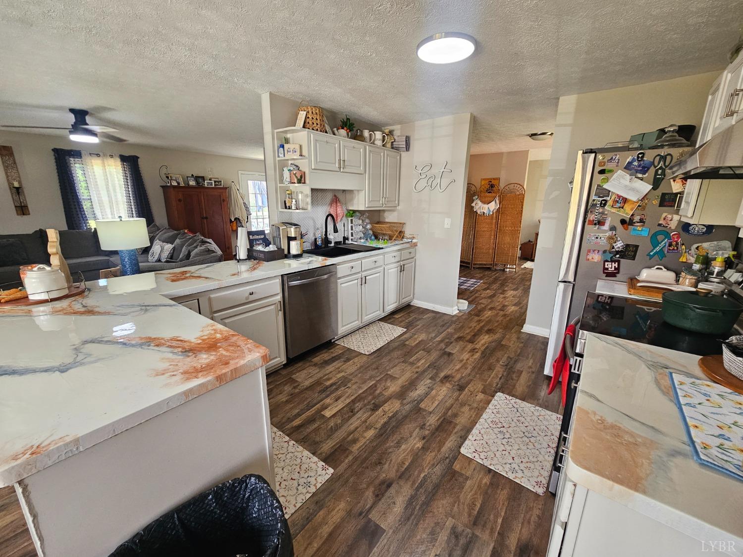 1390 Jacobs Road Hurt, VA 24563 - Photo 7 of 30 a room with wooden floor and cabinets