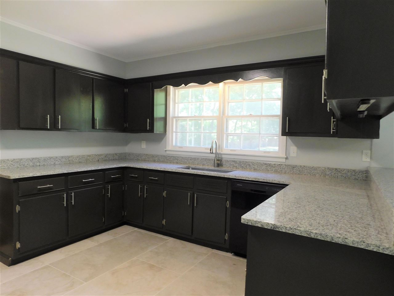 990 Blanchard Road Memphis, TN 38116 - Photo 11 of 25 This view of kitchen shows the massive amount cabinet space and the deep stainless sink.