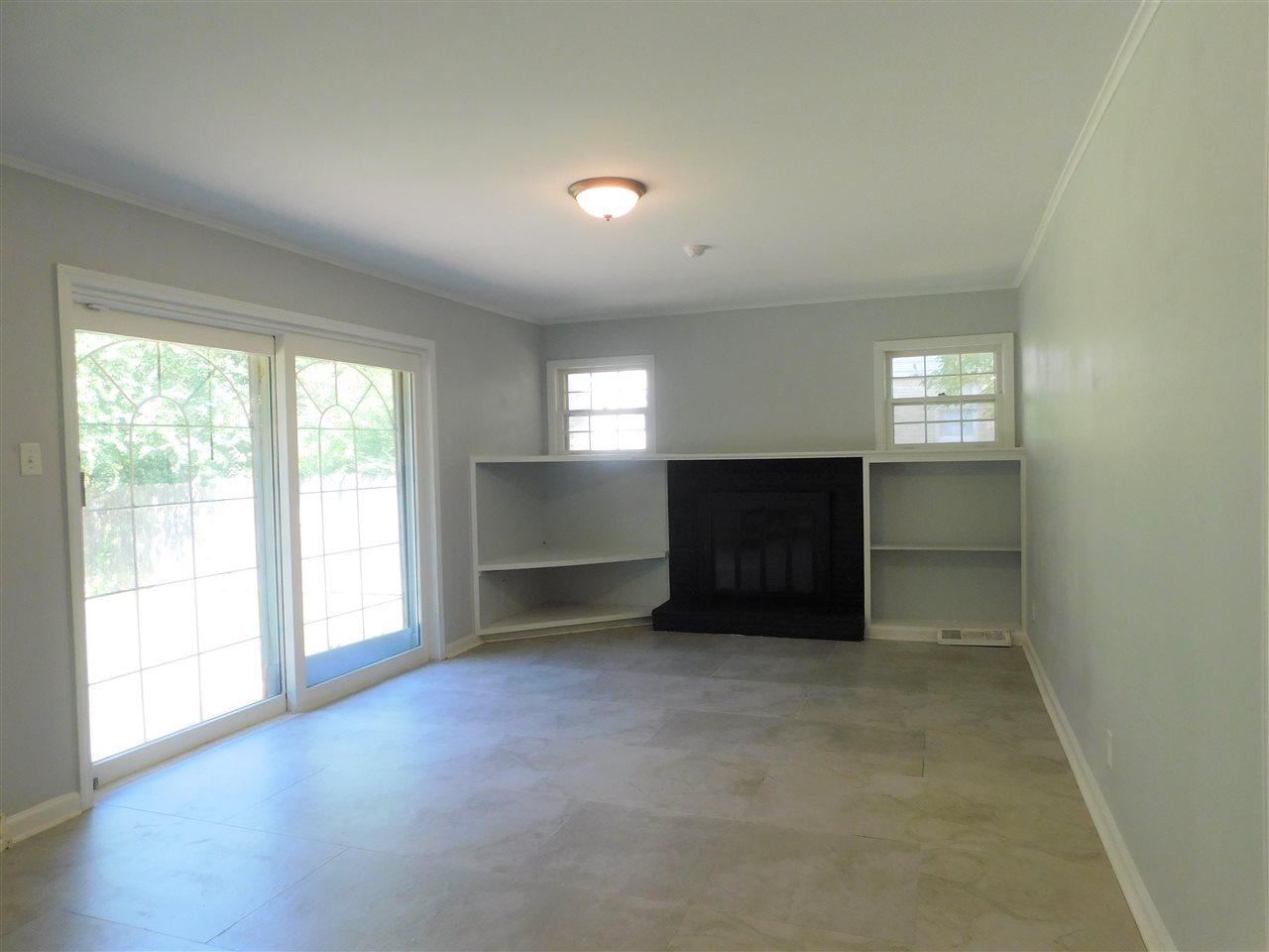990 Blanchard Road Memphis, TN 38116 - Photo 13 of 25 Nice size with built-in shelves and wood burning fireplace.