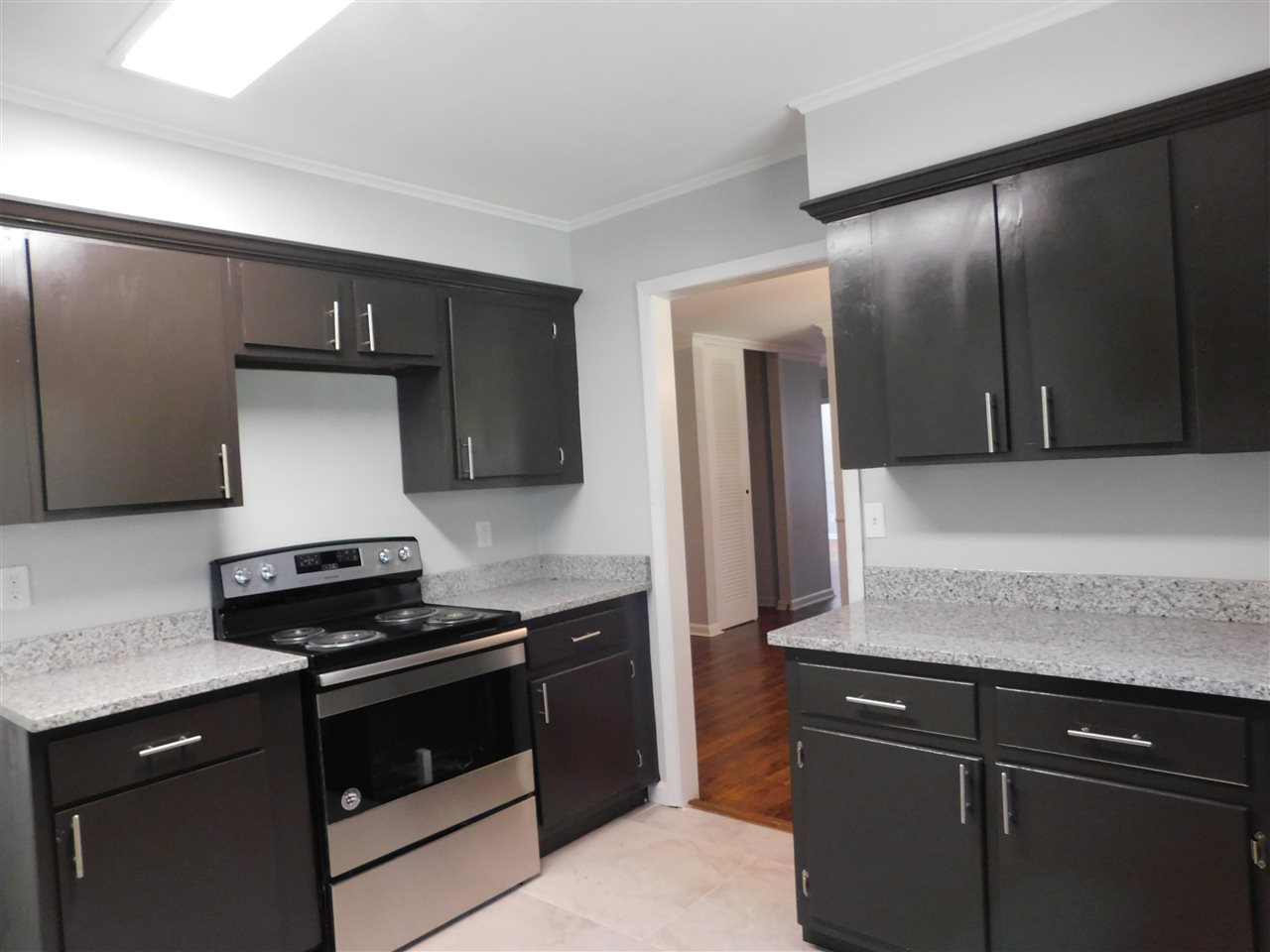 990 Blanchard Road Memphis, TN 38116 - Photo 8 of 25 Spacious, lots of cabinet spaces, granite countertops, new floors, new stainless/black stove.