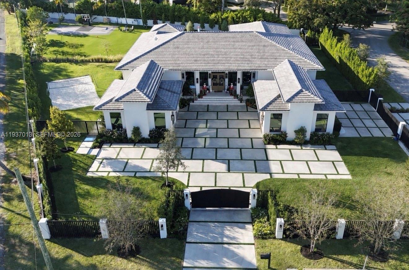 14200 Old Cutler Road Palmetto Bay, FL 33158 - Photo 1 of 43 a aerial view of a house with a garden and plants