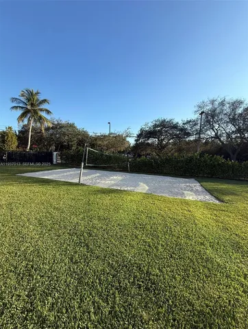 a view of a swimming pool and a yard