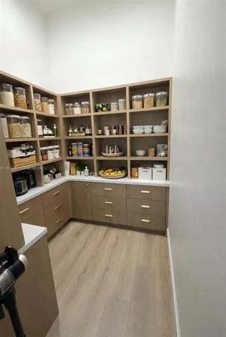 a living room with lots of furniture and a book shelf