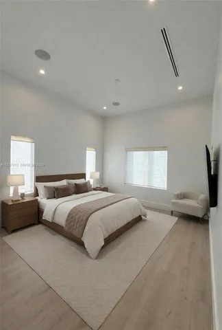 a bedroom with a bed and a couch