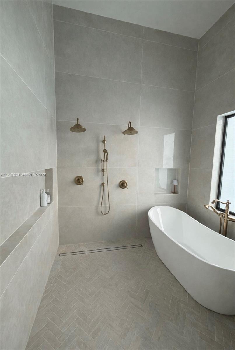 14200 Old Cutler Road Palmetto Bay, FL 33158 - Photo 33 of 43 a spacious bathroom with a double vanity sink a toilet and shower