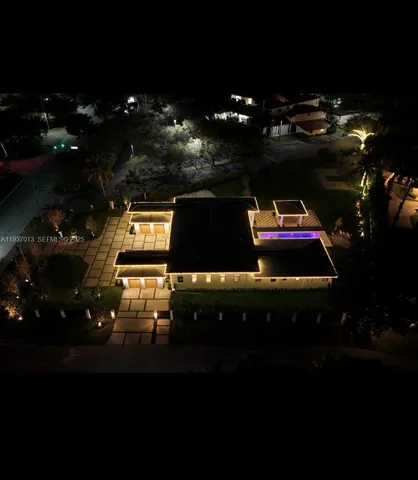 a table with chairs and lamp with coffee table