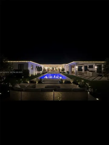 a view of swimming pool with seating space