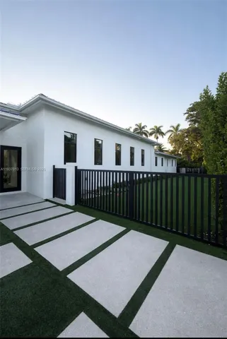 a view of a house with wooden deck