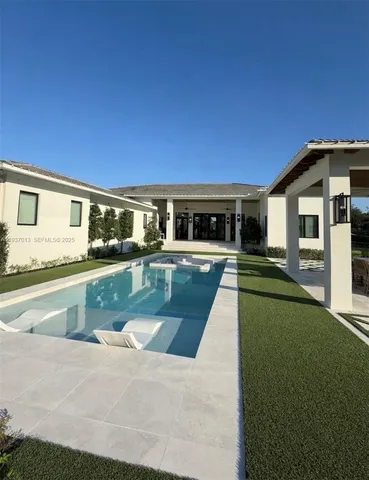 a view of a house with swimming pool
