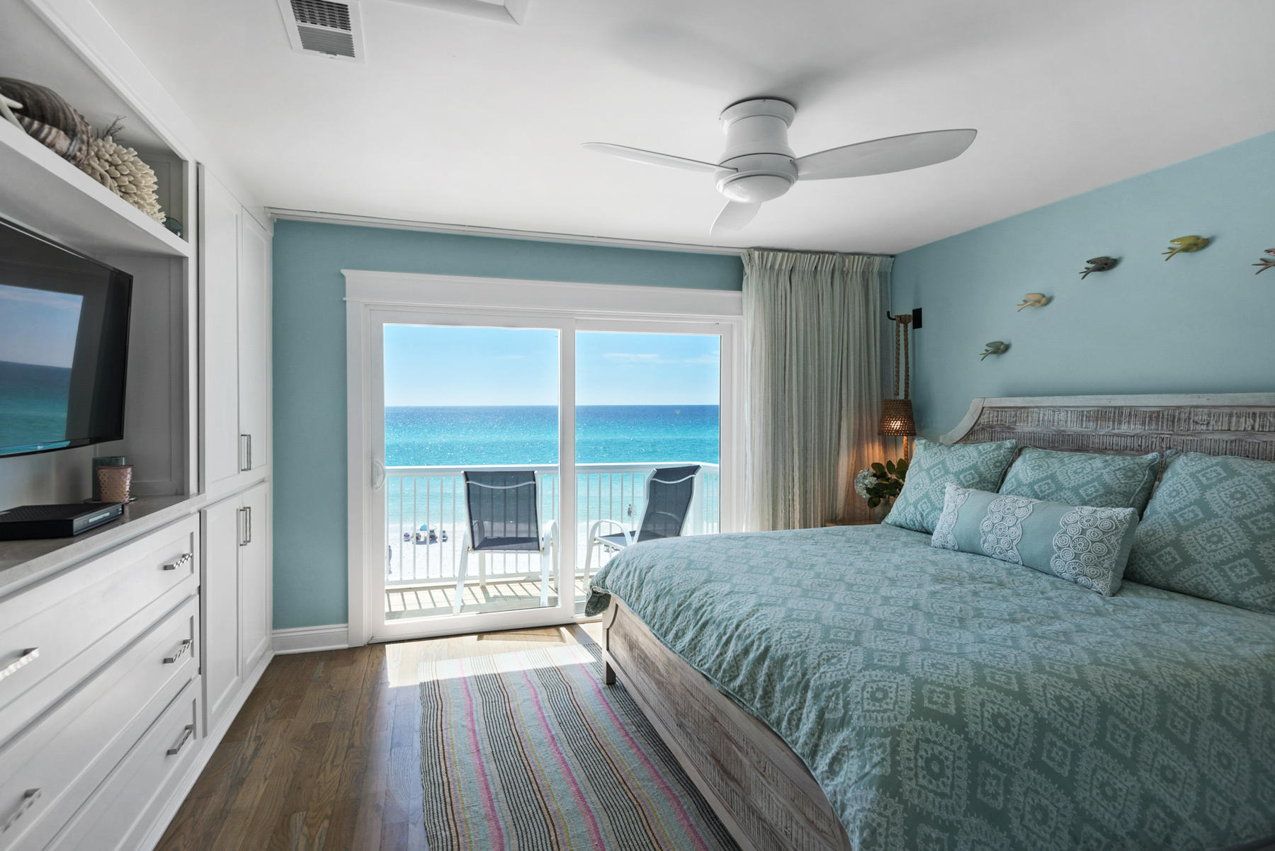 681 Eastern Lake Road, Unit 3 & 4 Santa Rosa Beach, FL 32459 - Photo 16 of 65 a spacious bedroom with a large bed and a flat tv screen on dresser