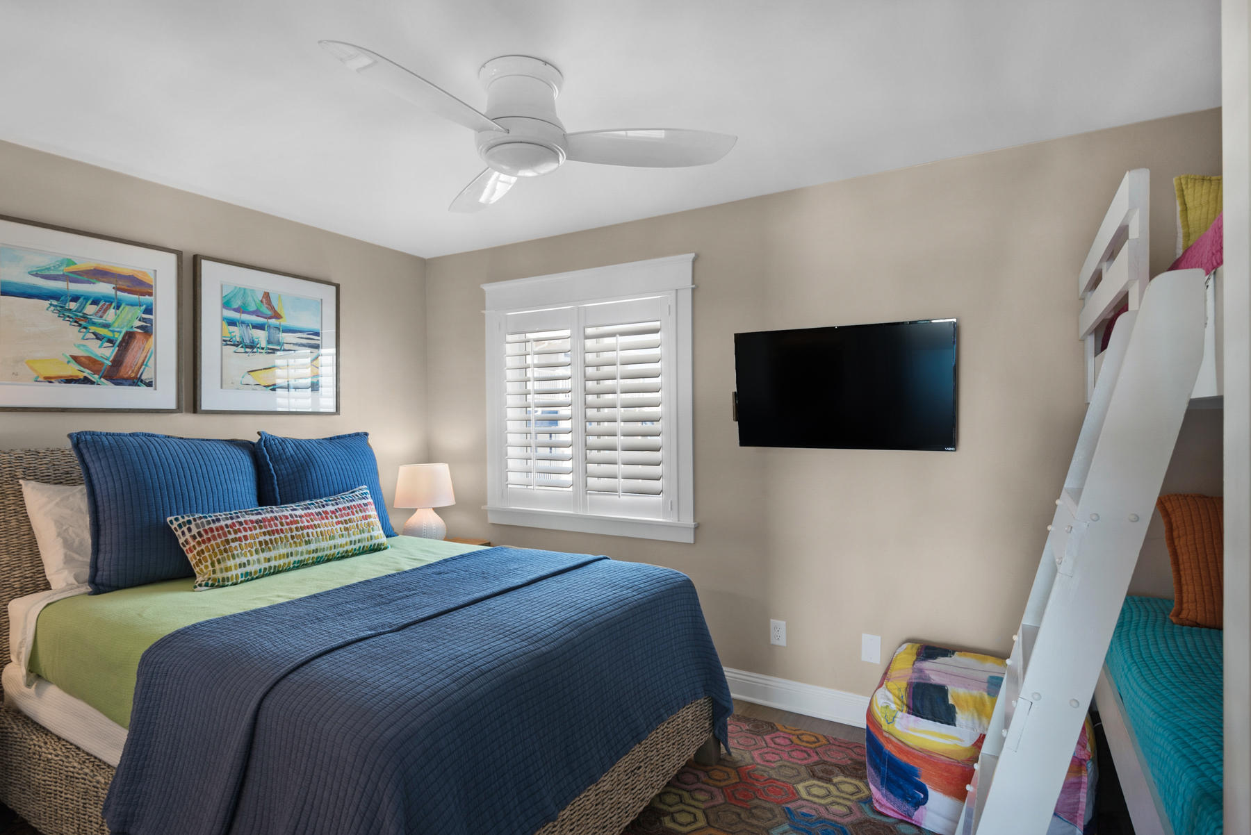 681 Eastern Lake Road, Unit 3 & 4 Santa Rosa Beach, FL 32459 - Photo 22 of 65 a bedroom with a bed a flat screen tv and a window