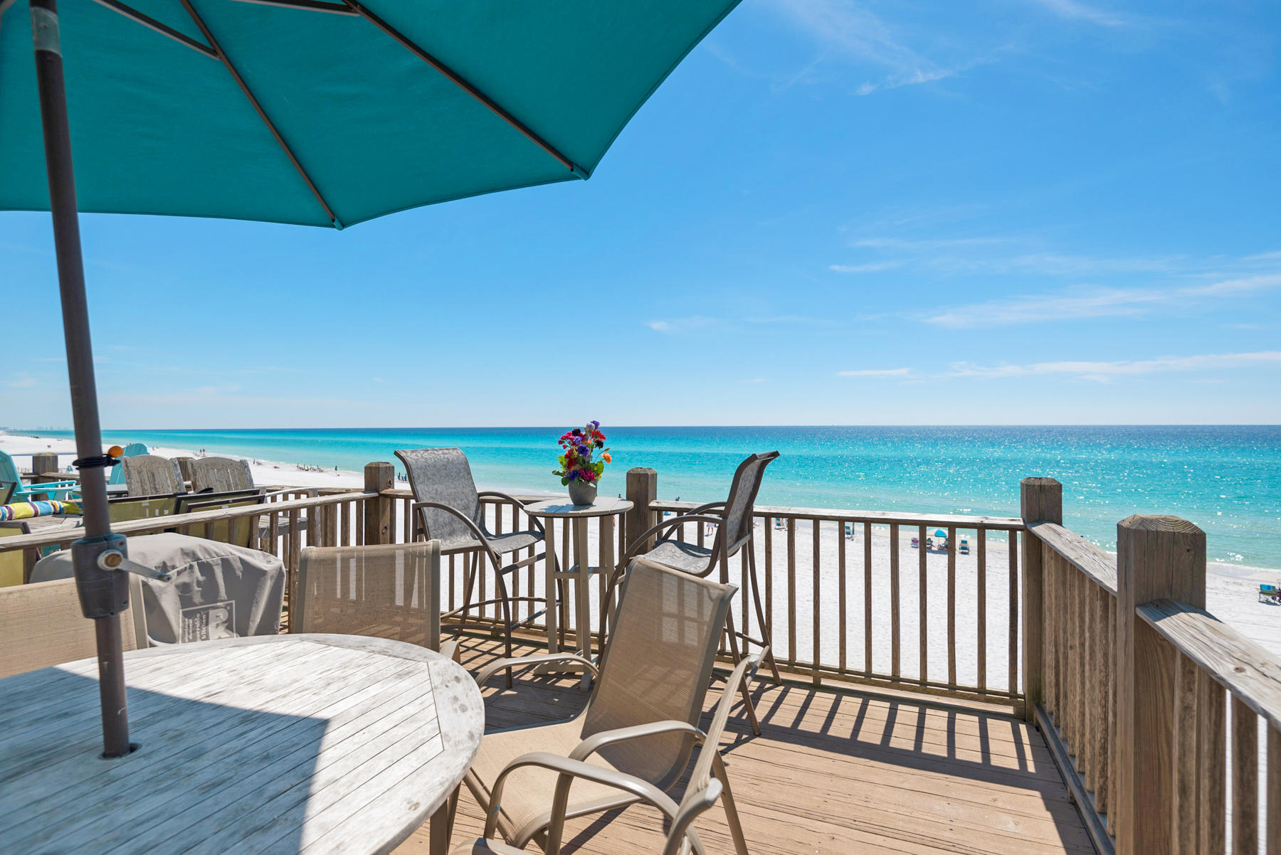 681 Eastern Lake Road, Unit 3 & 4 Santa Rosa Beach, FL 32459 - Photo 51 of 65 a balcony with table and chairs
