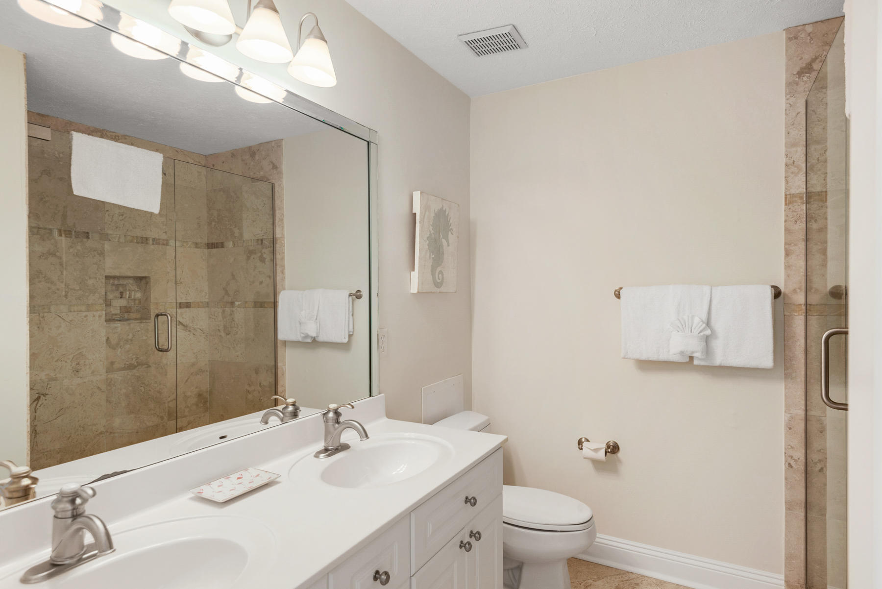 681 Eastern Lake Road, Unit 3 & 4 Santa Rosa Beach, FL 32459 - Photo 58 of 65 a bathroom with a sink a toilet and a large mirror