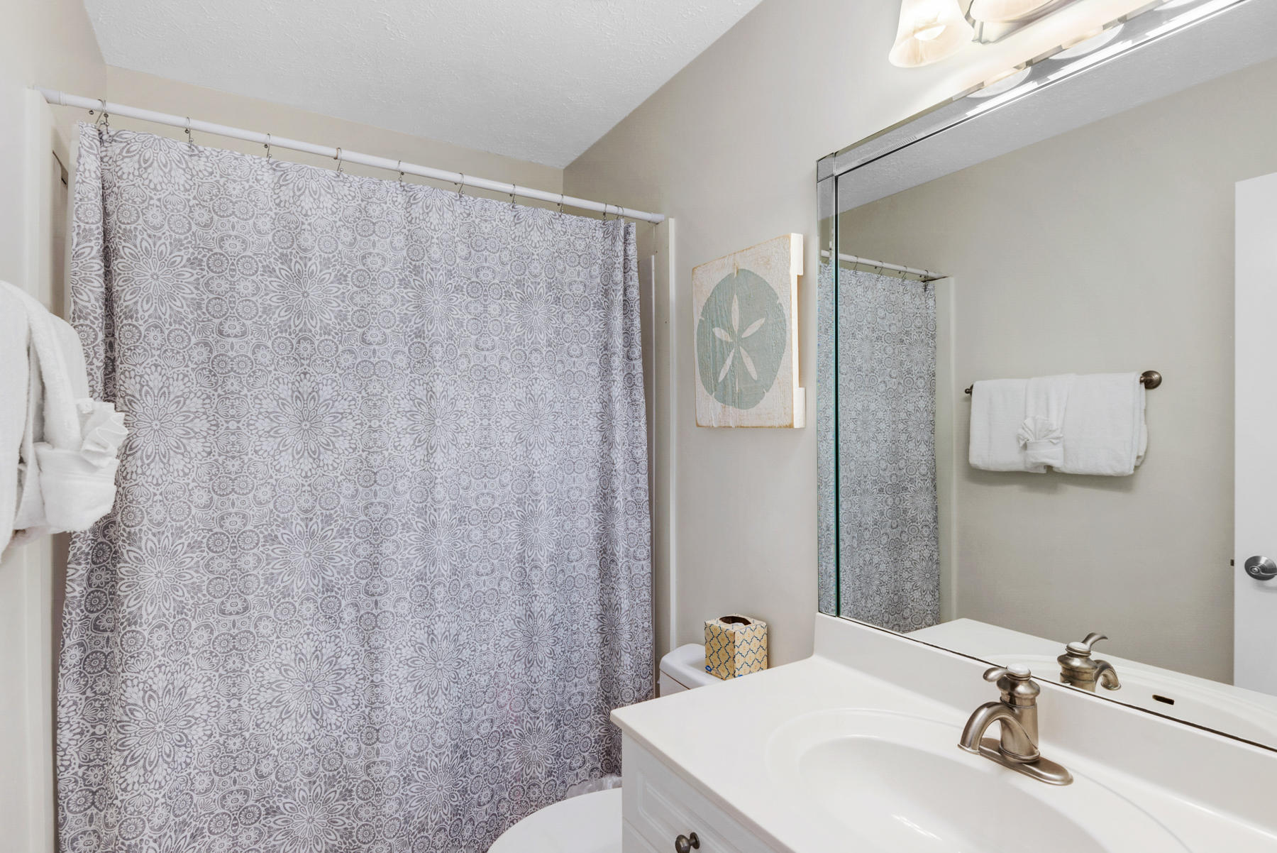681 Eastern Lake Road, Unit 3 & 4 Santa Rosa Beach, FL 32459 - Photo 63 of 65 a bathroom with a sink and a mirror