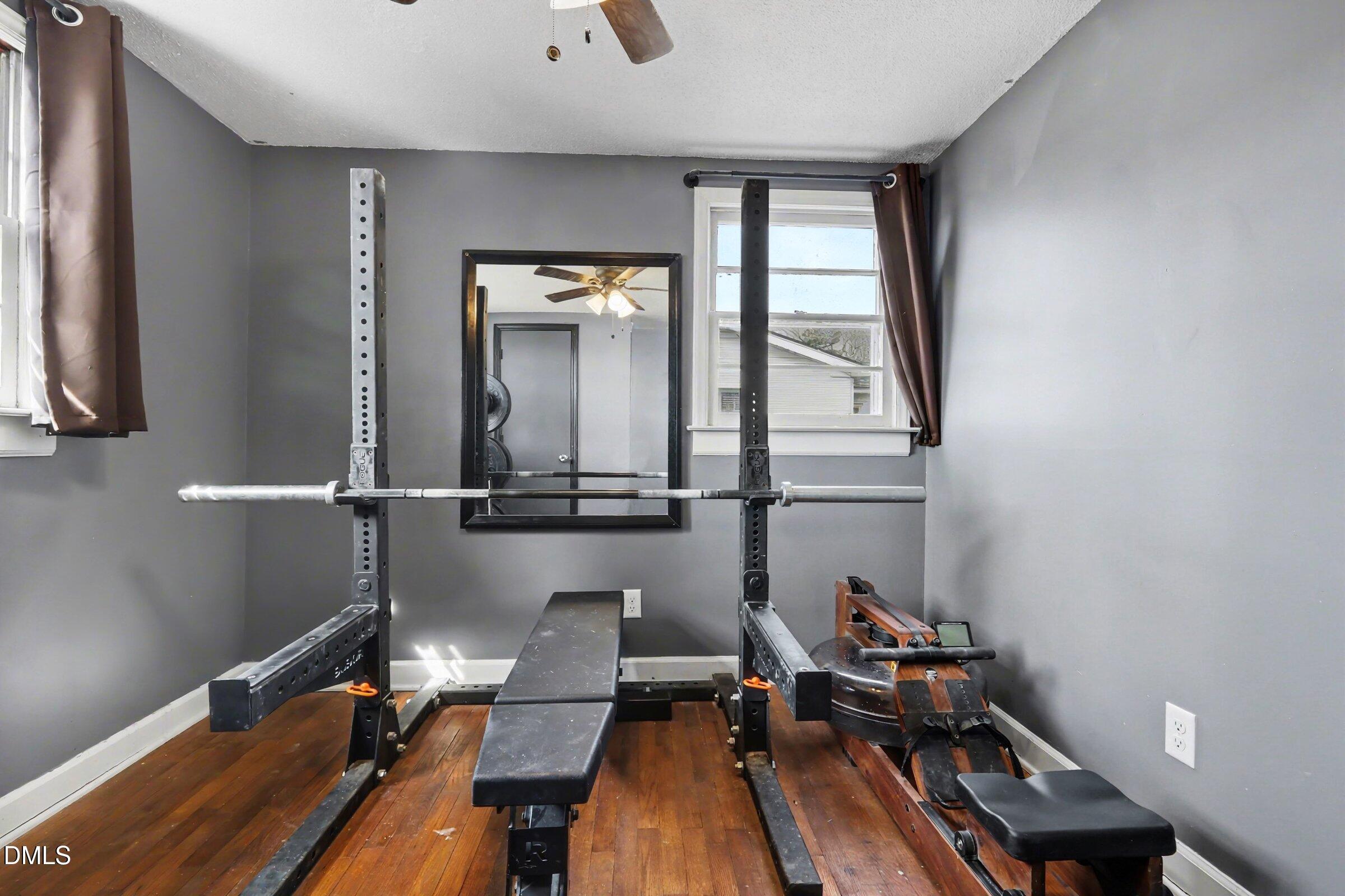 5776 Pearces Road Louisburg, NC 27549 - Photo 15 of 32 a view of a workspace with furniture and a window