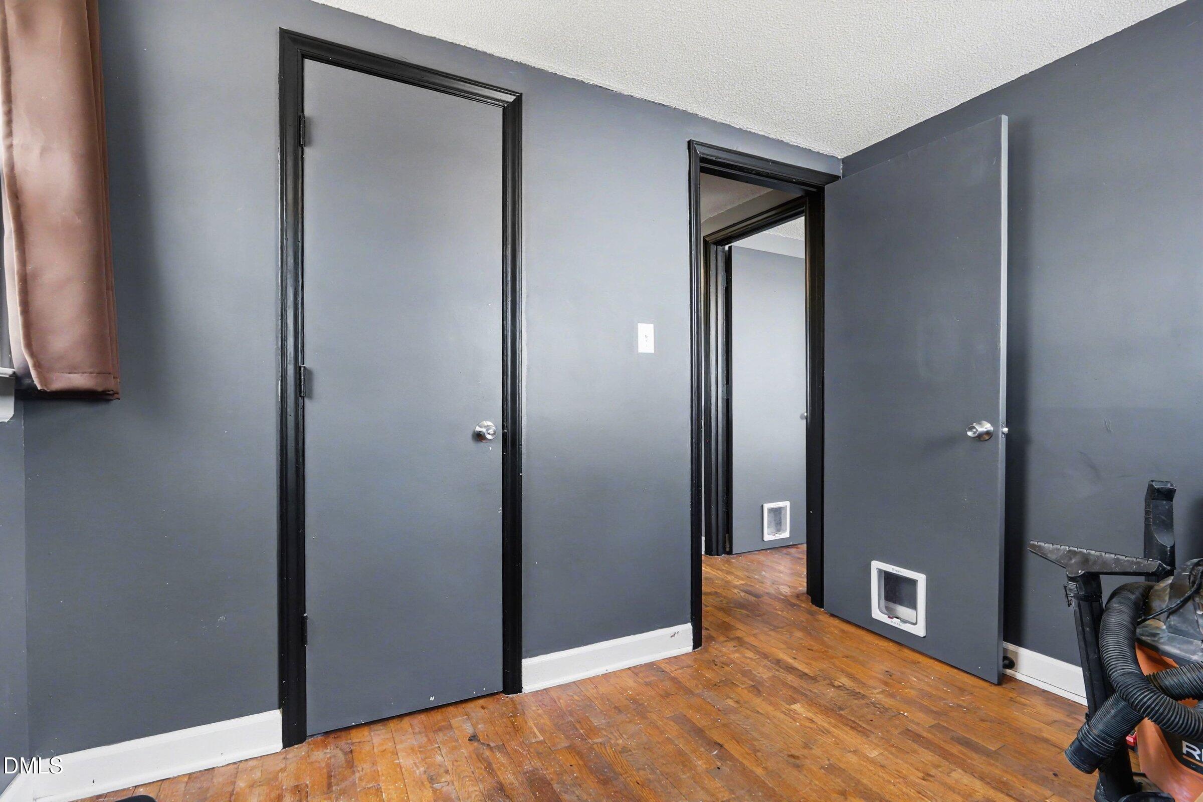 5776 Pearces Road Louisburg, NC 27549 - Photo 18 of 32 a bedroom with a bed and a mirror