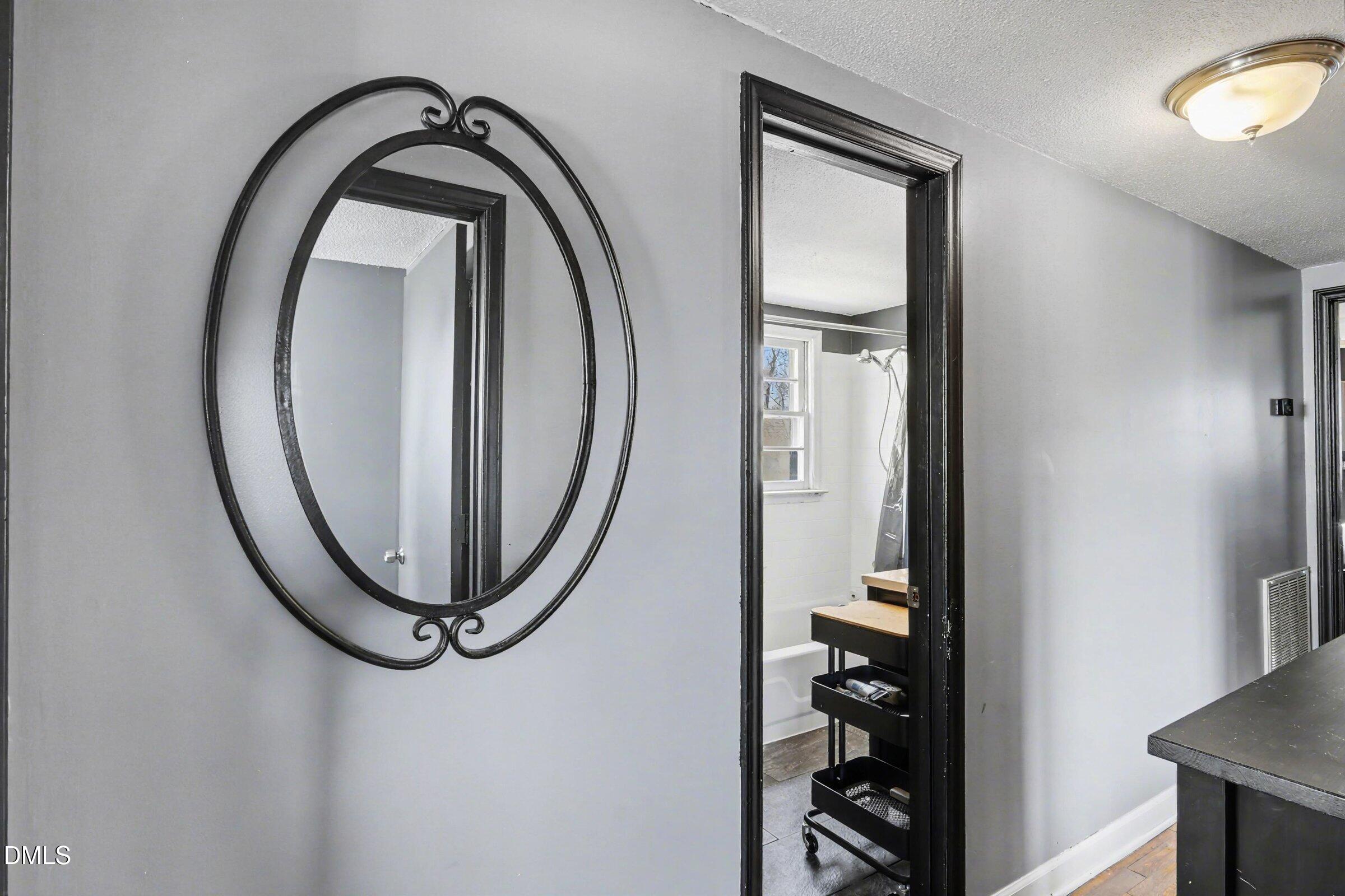 5776 Pearces Road Louisburg, NC 27549 - Photo 19 of 32 a close view of light fixtures and entryway