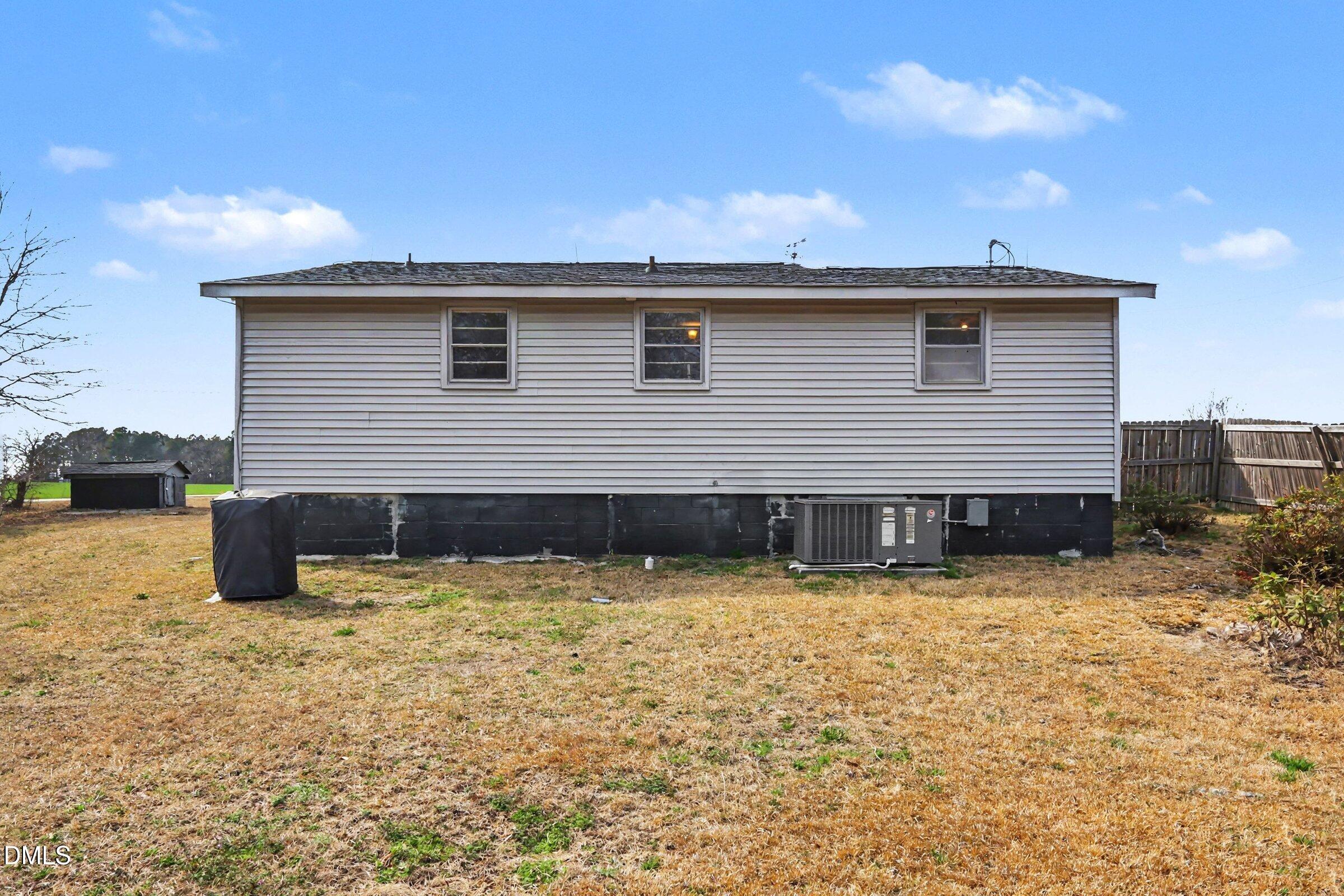 5776 Pearces Road Louisburg, NC 27549 - Photo 30 of 32 a view of a house with wooden fence