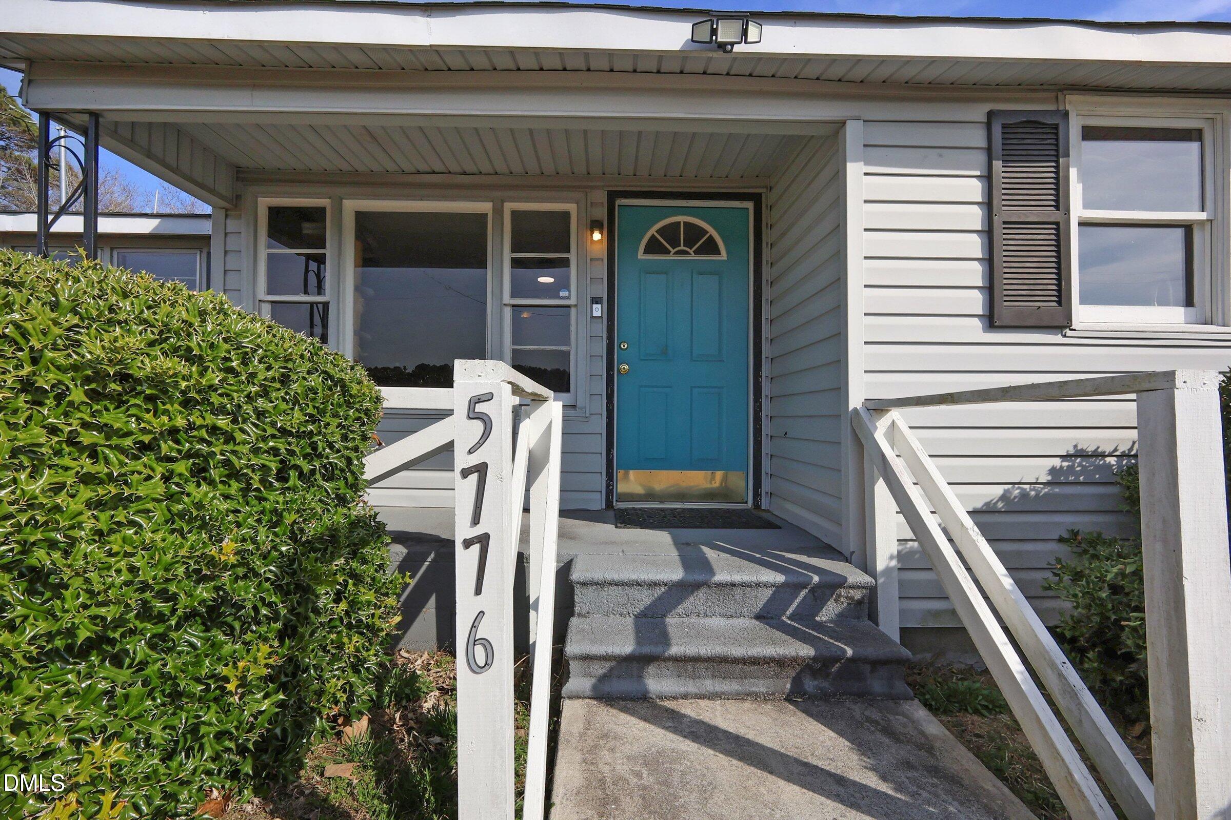 5776 Pearces Road Louisburg, NC 27549 - Photo 6 of 32 a view of a house with a balcony