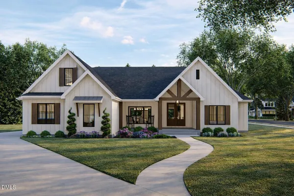 a front view of house with yard and green space