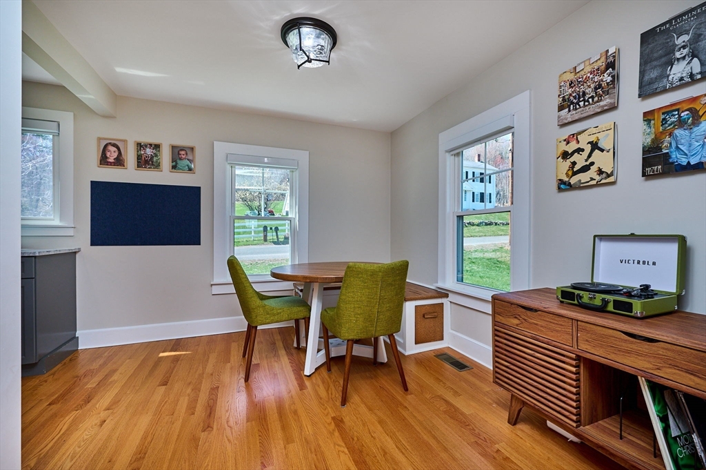 69 High Street Southampton, MA 01073 - Photo 13 of 40 a dining room with furniture and wooden floor