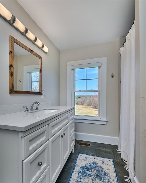 69 High Street Southampton, MA 01073 - Photo 16 of 40 a bathroom with a sink and a mirror