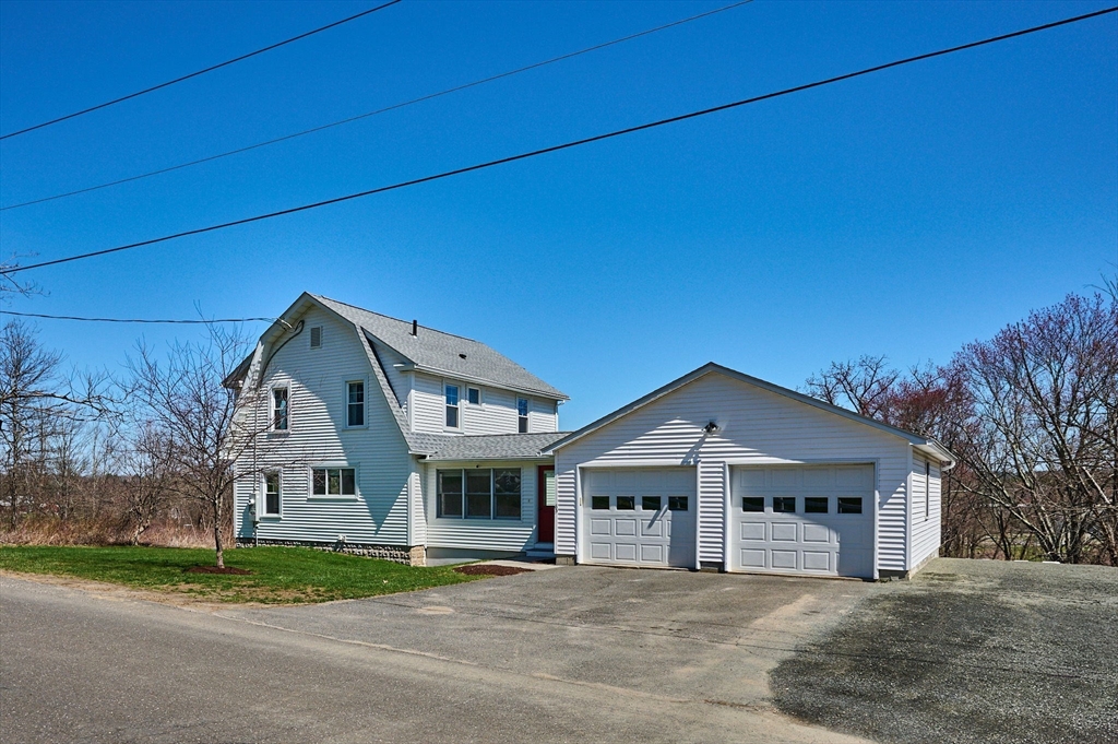 69 High Street Southampton, MA 01073 - Photo 2 of 40 a front view of a house with a yard