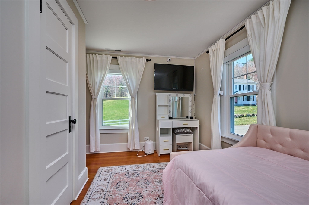 69 High Street Southampton, MA 01073 - Photo 23 of 40 a bedroom with a bed and a television
