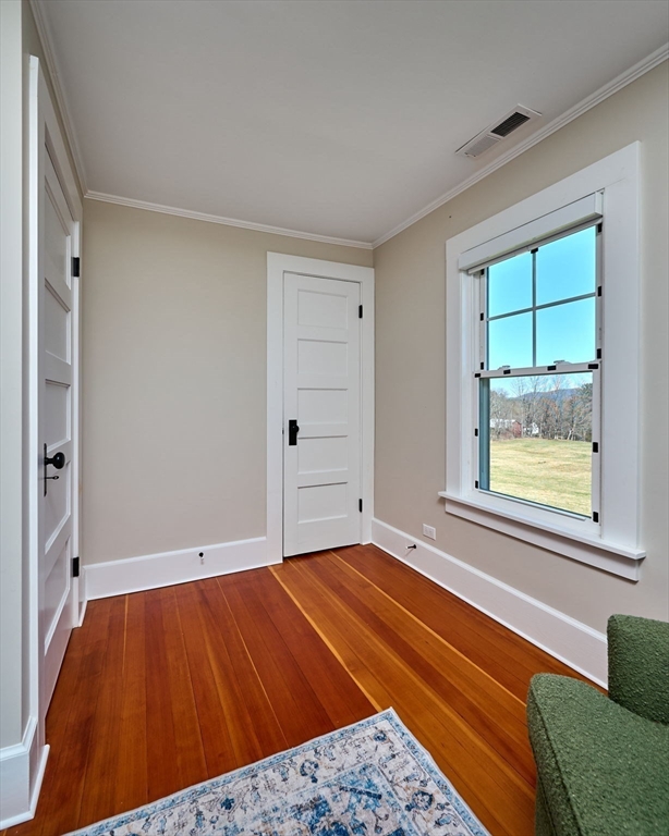 69 High Street Southampton, MA 01073 - Photo 25 of 40 a view of an empty room with a window and wooden floor